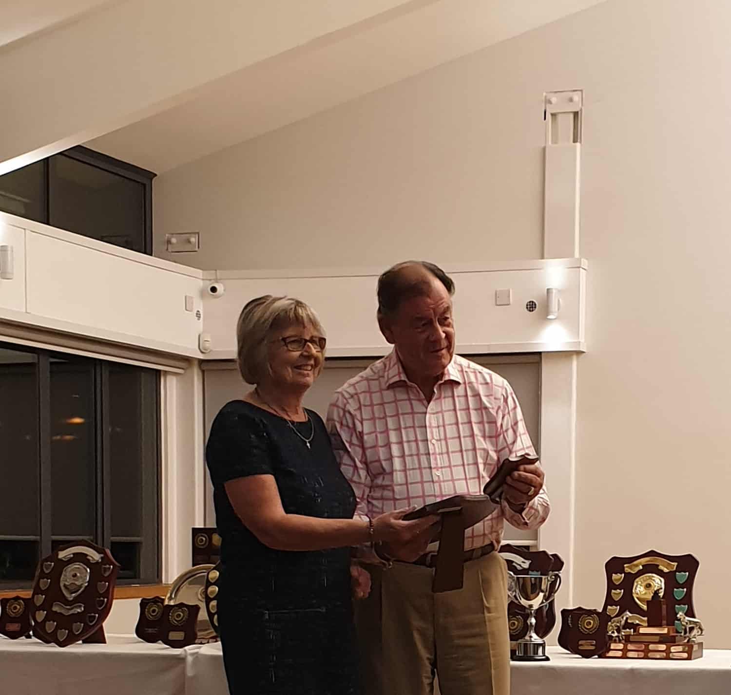 Member receiving trophy